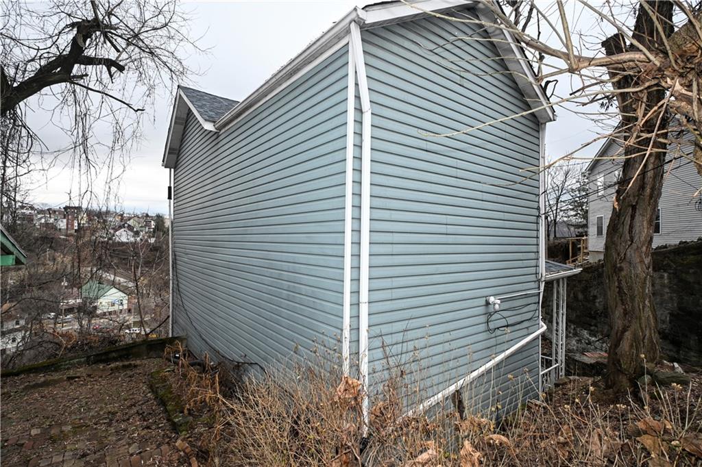 417 Lawn Street Pittsburgh, PA 15213 - Photo 5 of 26 a view of a house with a yard and garage