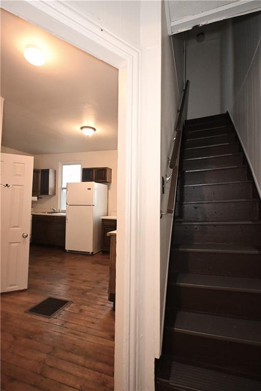 417 Lawn Street Pittsburgh, PA 15213 - Photo 10 of 26 a view of a room with wooden floor and stairs
