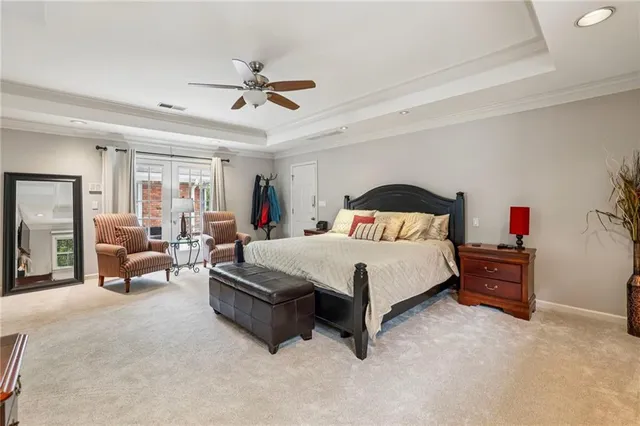 a spacious bedroom with a bed and furniture