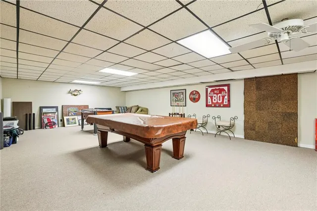 a room with furniture and pool table
