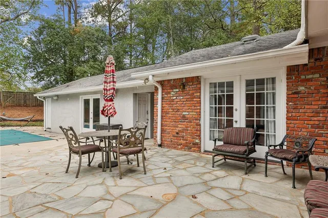 a patio with table and chairs