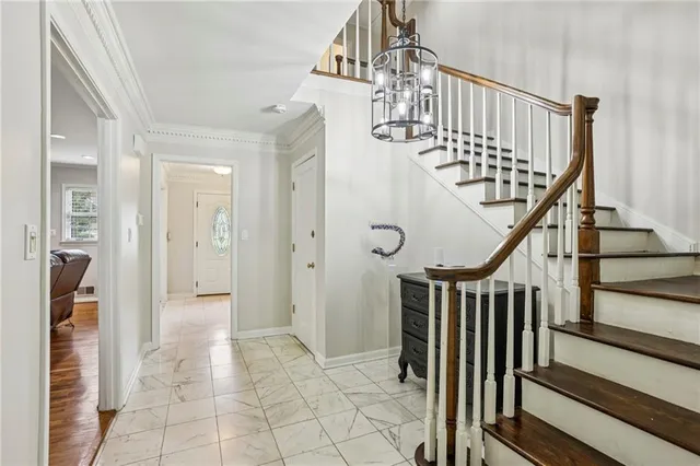 a view of entryway with wooden floor and stairs