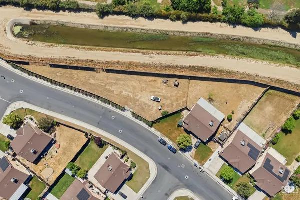 an aerial view of a house with a ocean view