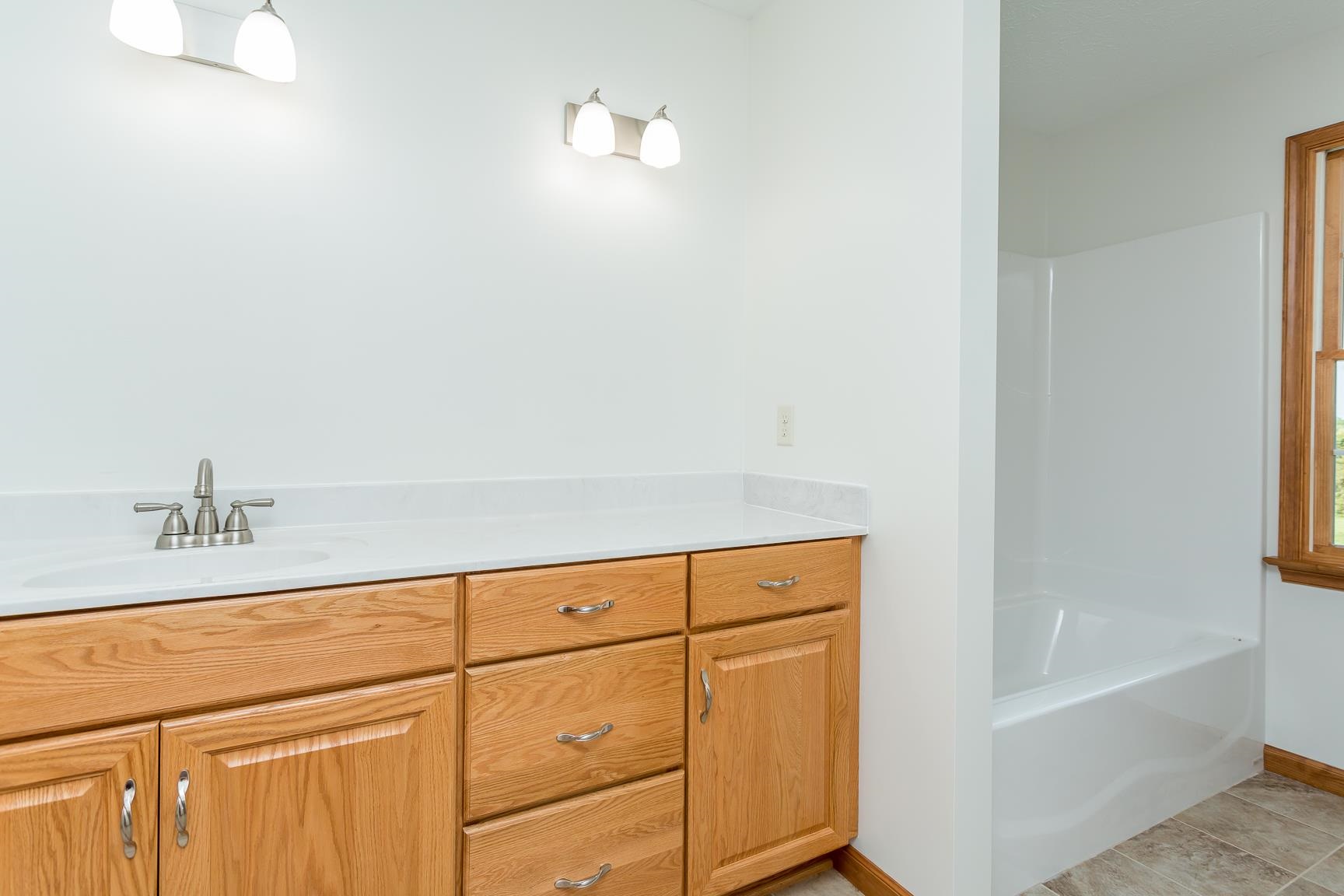 297 Battlefield Road Waynesboro, VA 22980 - Photo 22 of 61 a bathroom with a bathtub and a sink