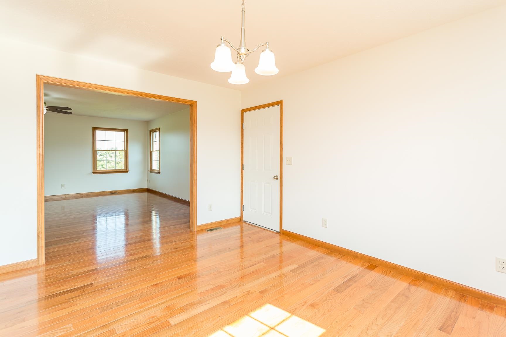 297 Battlefield Road Waynesboro, VA 22980 - Photo 34 of 61 a view of an empty room with wooden floor and a large window