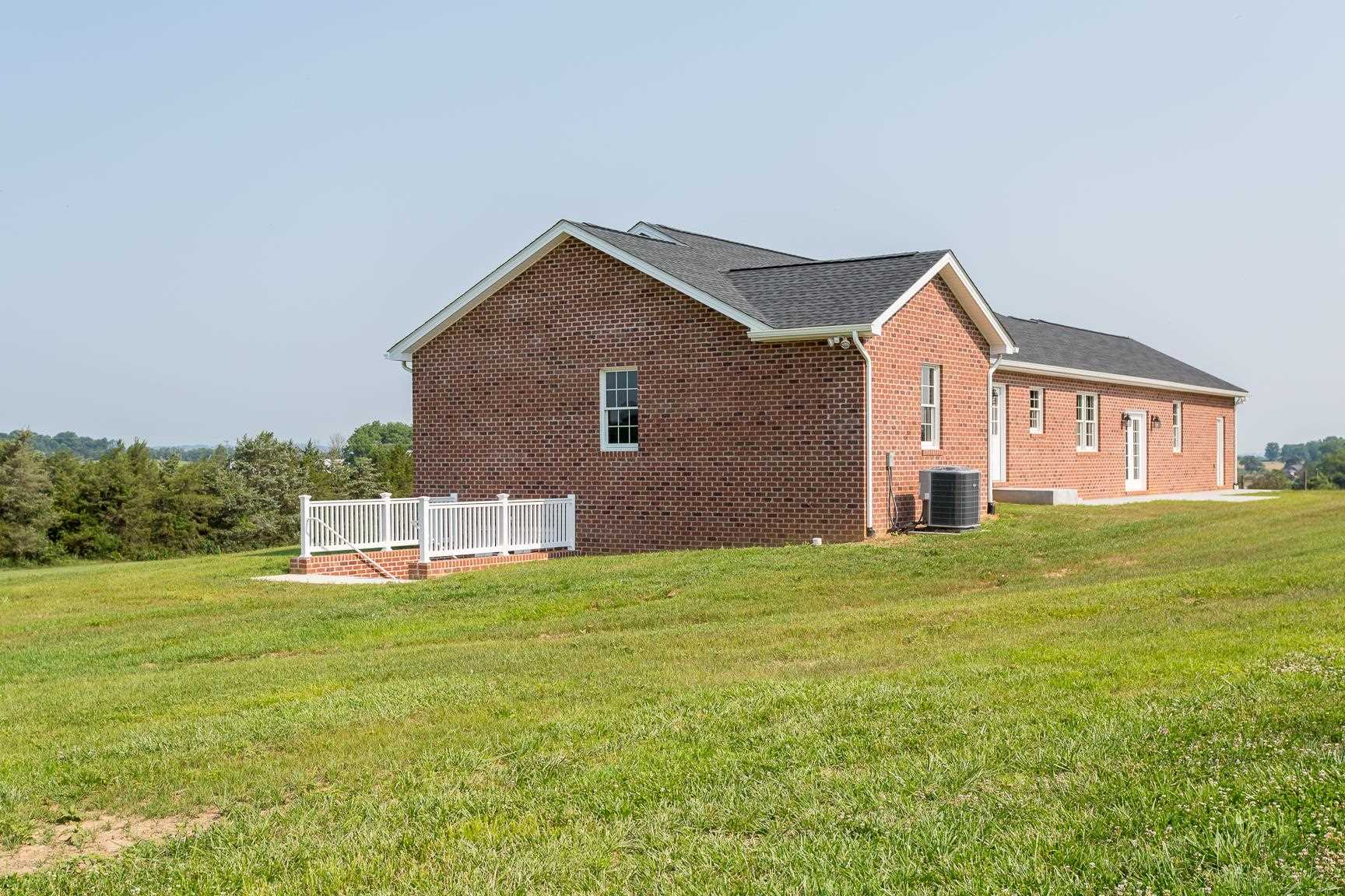 297 Battlefield Road Waynesboro, VA 22980 - Photo 46 of 61 a front view of a house with a yard and garage