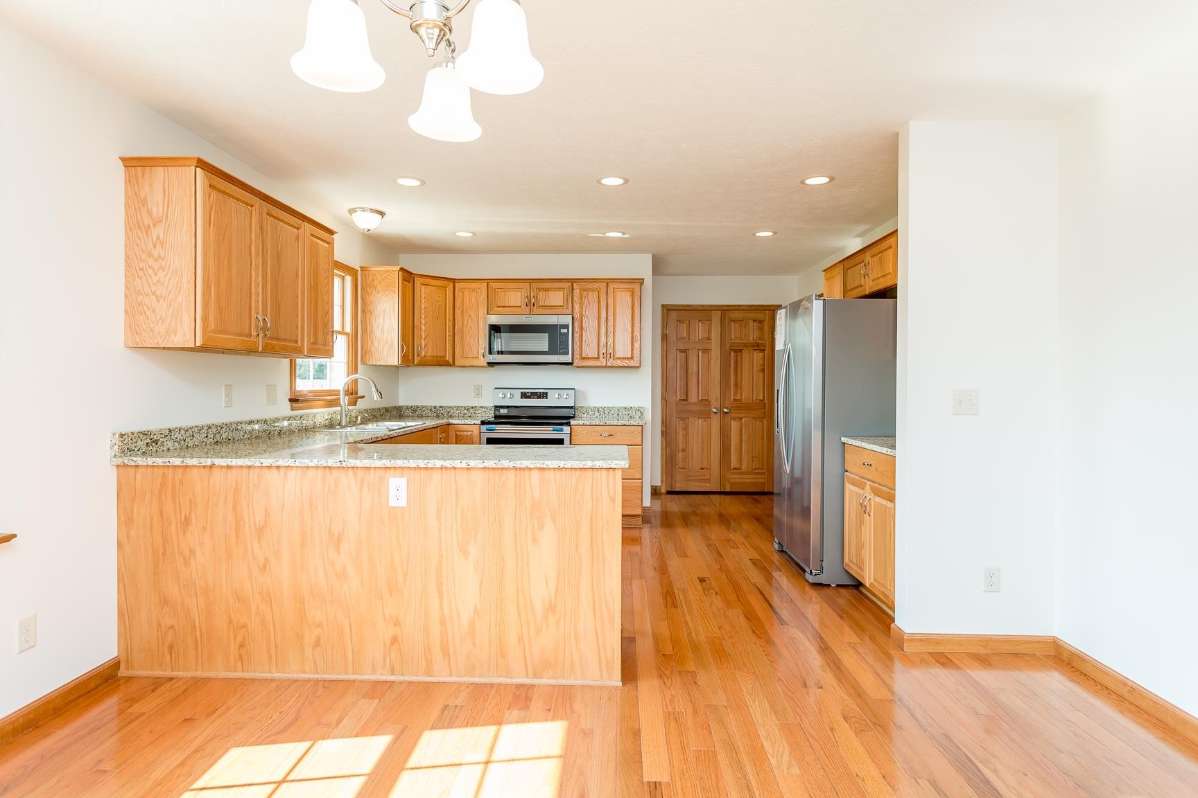 297 Battlefield Road Waynesboro, VA 22980 - Photo 5 of 61 a kitchen with stainless steel appliances granite countertop a refrigerator and a stove top oven