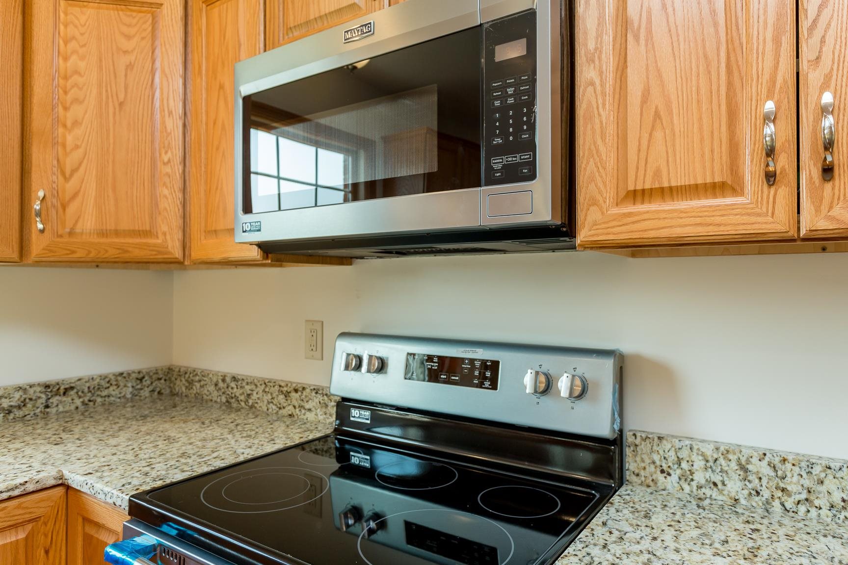 297 Battlefield Road Waynesboro, VA 22980 - Photo 7 of 61 a kitchen with a stove and a microwave