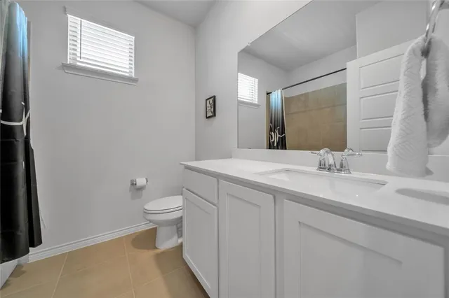 a bed room with a bed and a tv