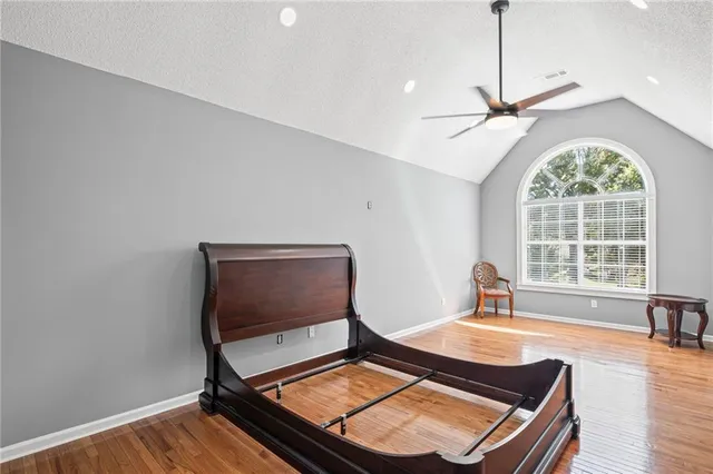 a living room with a bed furniture and a window