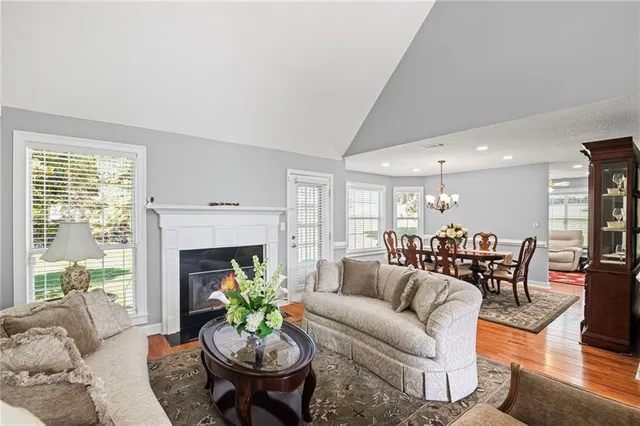 a living room with furniture fireplace and window