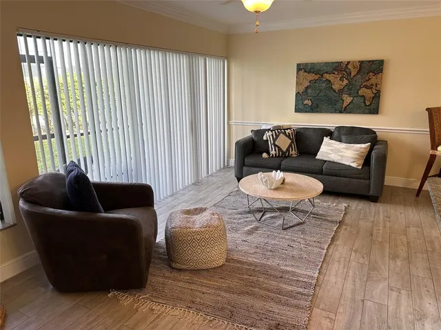 a living room with furniture and a rug