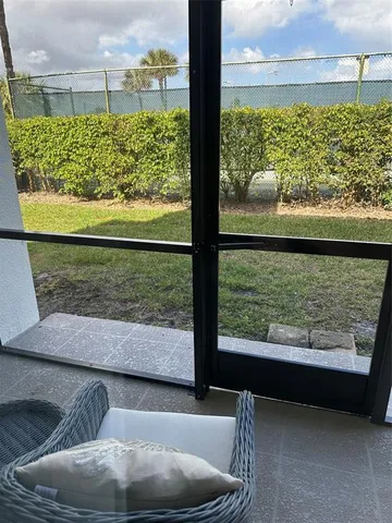 a view of a back yard from a balcony