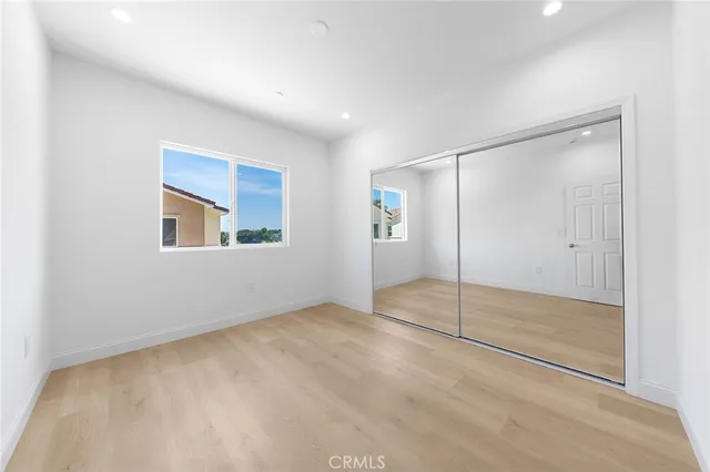 a view of a house with a yard and a garden