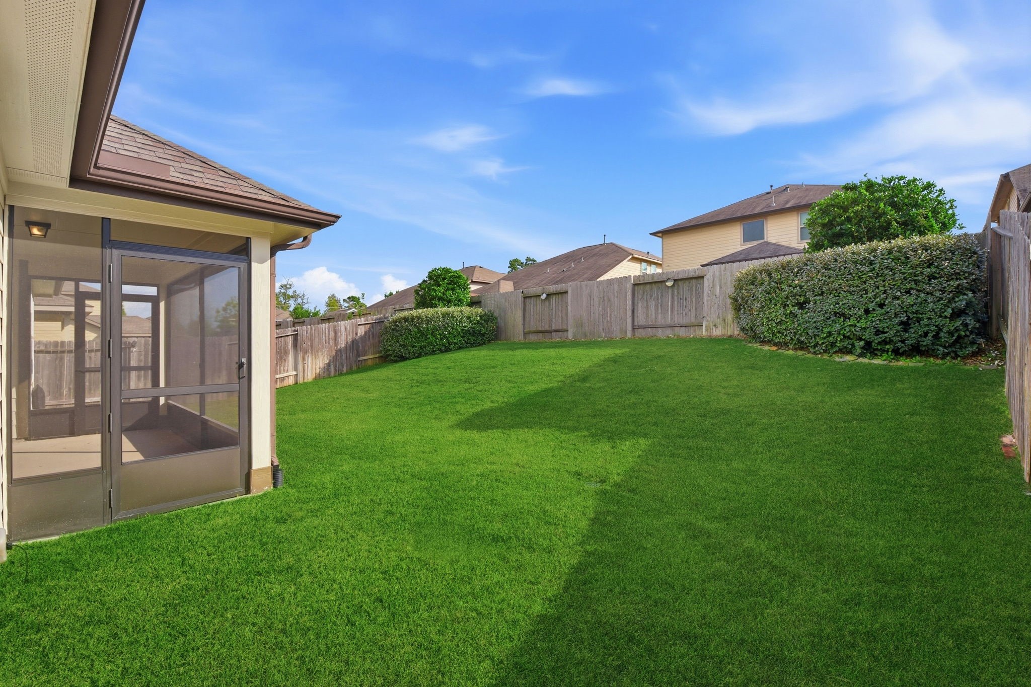 12411 Southern Trail Court Magnolia, TX 77354 - Photo 13 of 38 a view of a house with a backyard