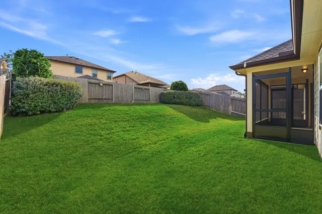 a view of a back yard of the house