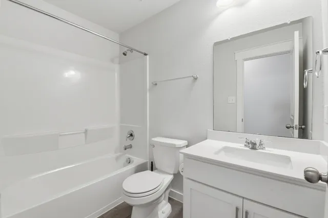 a bathroom with a sink toilet and a bathtub