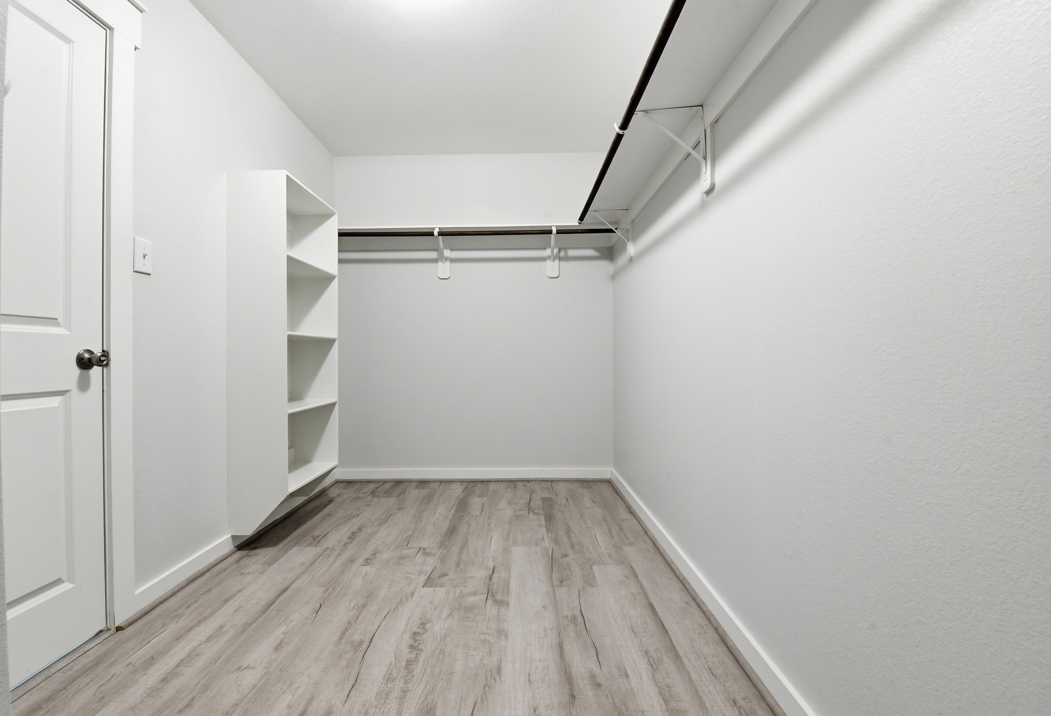 12411 Southern Trail Court Magnolia, TX 77354 - Photo 23 of 38 a view of walk in closet with empty racks