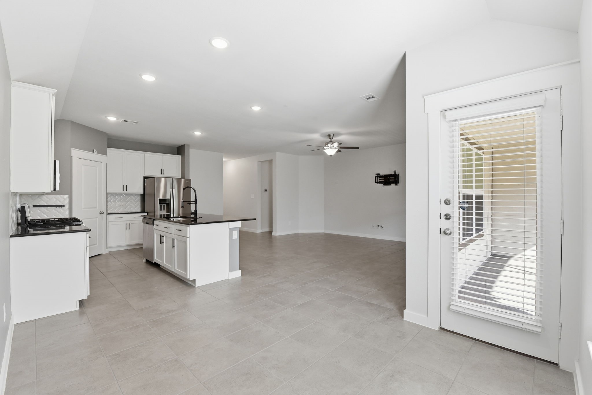12411 Southern Trail Court Magnolia, TX 77354 - Photo 3 of 38 a view of kitchen with stainless steel appliances refrigerator oven and white cabinets