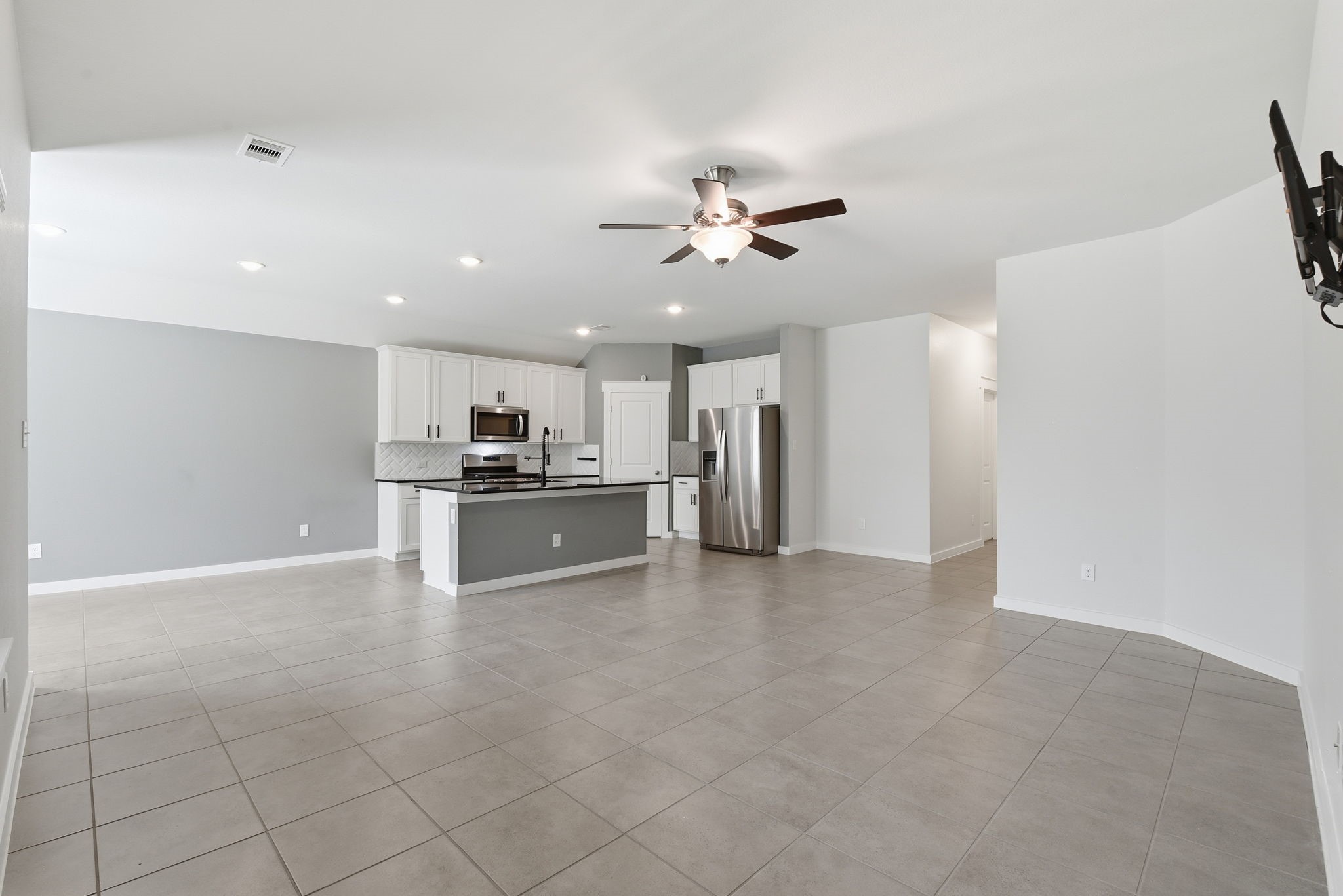 12411 Southern Trail Court Magnolia, TX 77354 - Photo 32 of 38 a view of kitchen with livingroom and refrigerator