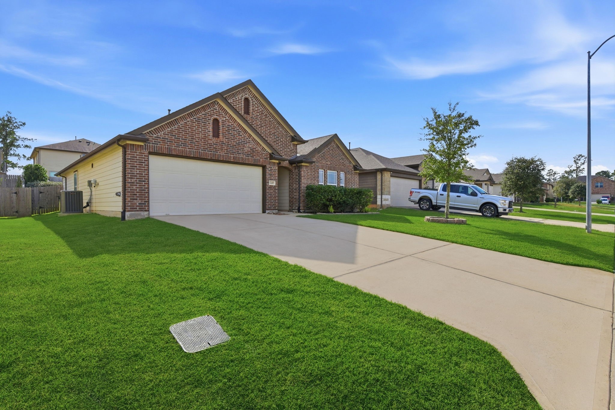 12411 Southern Trail Court Magnolia, TX 77354 - Photo 8 of 38 a view of a house with a yard