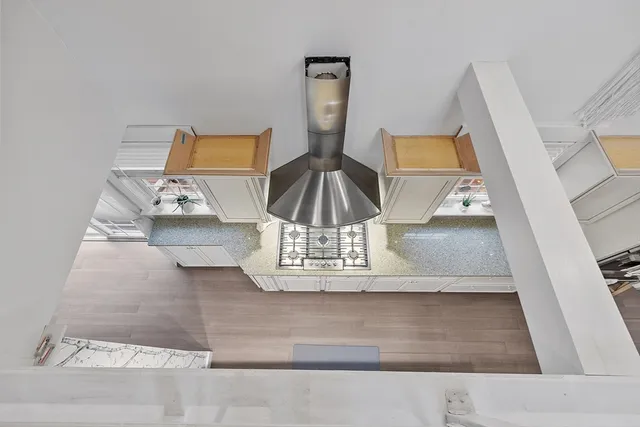 a view of staircase with a rug