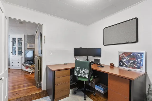 a workspace with furniture and wooden floor