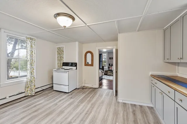 a kitchen with a refrigerator and a sink