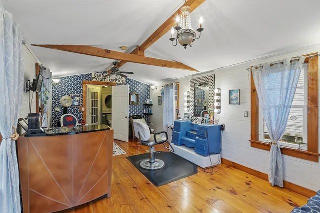a bathroom with a toilet sink vanity and mirror