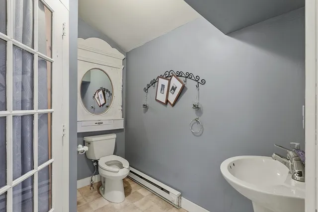 a view of a house with a yard and garage