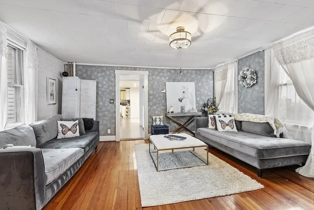 a living room with furniture and a rug