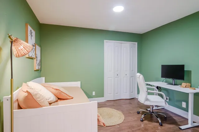 a workspace with furniture and a wooden floor