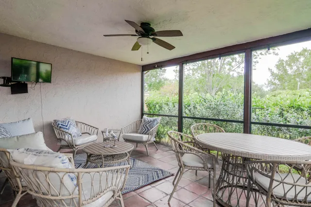 a view of a dining room with furniture window and outside view