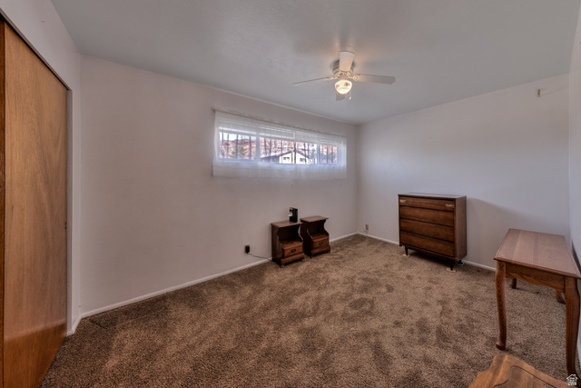 738 Locust Lane Moab, UT 84532 - Photo 12 of 25 Unfurnished bedroom featuring a closet, carpet floors, and ceiling fan