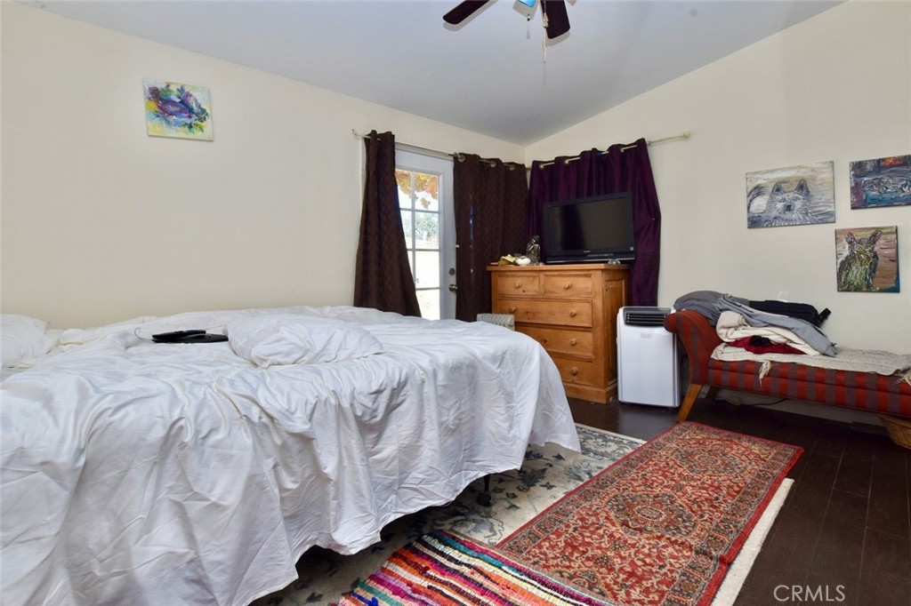 76980 San Antonio Road Bradley, CA 93426 - Photo 19 of 54 a bedroom with a bed a dresser and a window
