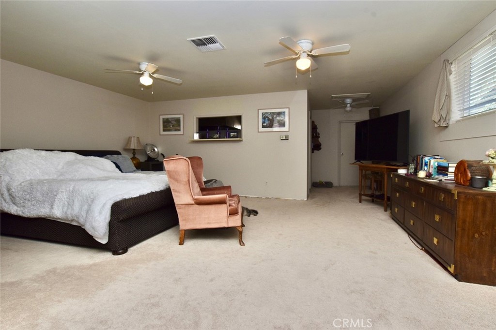 76980 San Antonio Road Bradley, CA 93426 - Photo 26 of 54 a bedroom with a bed couch tv and a window