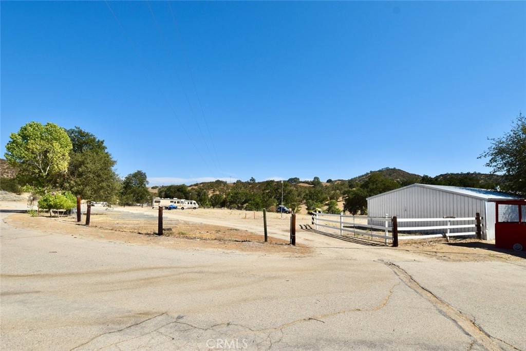 76980 San Antonio Road Bradley, CA 93426 - Photo 34 of 54 a view of a terrace with a bench and trees