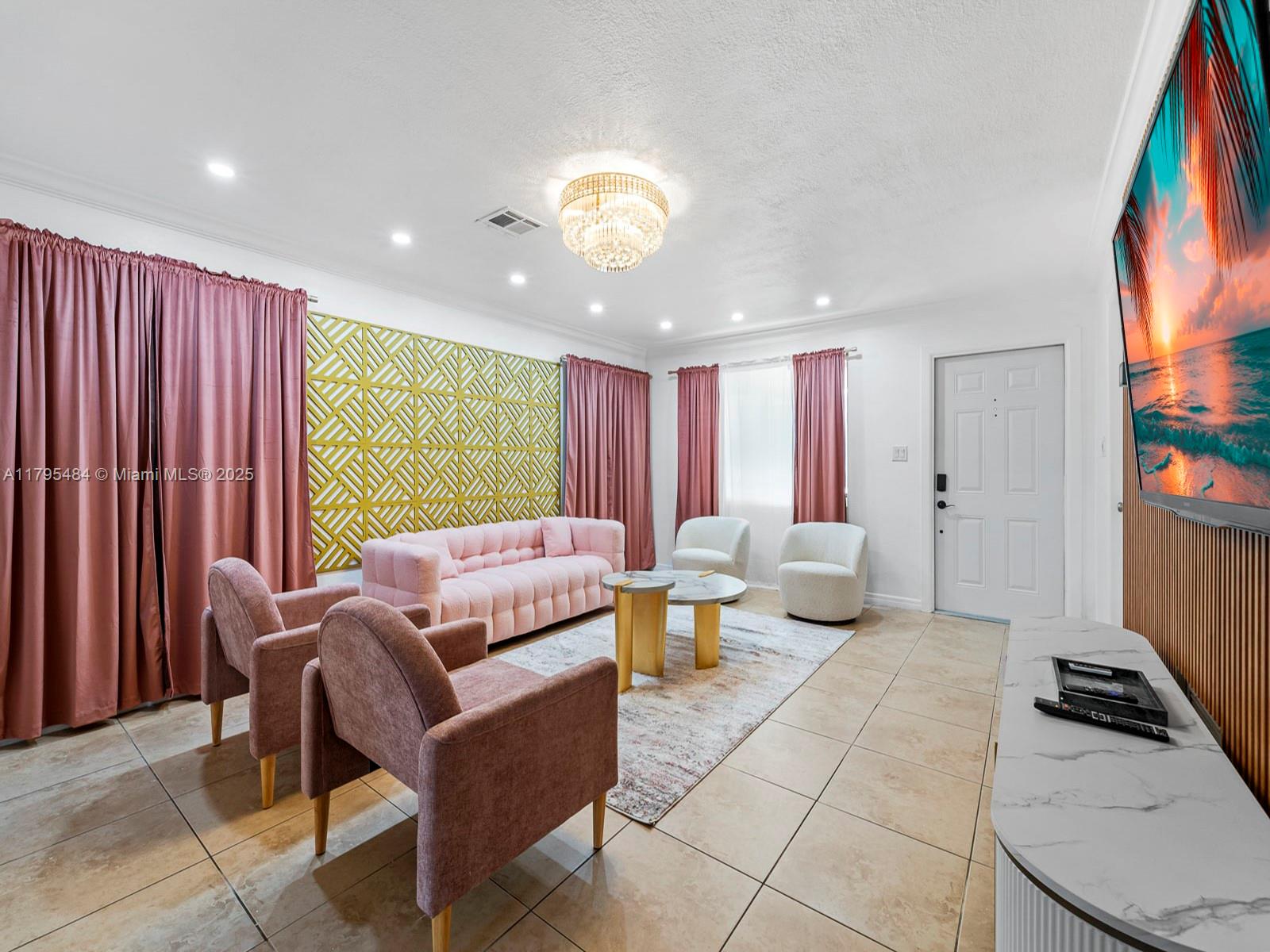 1761 Northeast 52nd Street, Unit 12 Fort Lauderdale, FL 33334 - Photo 13 of 19 a living room with furniture and a large window