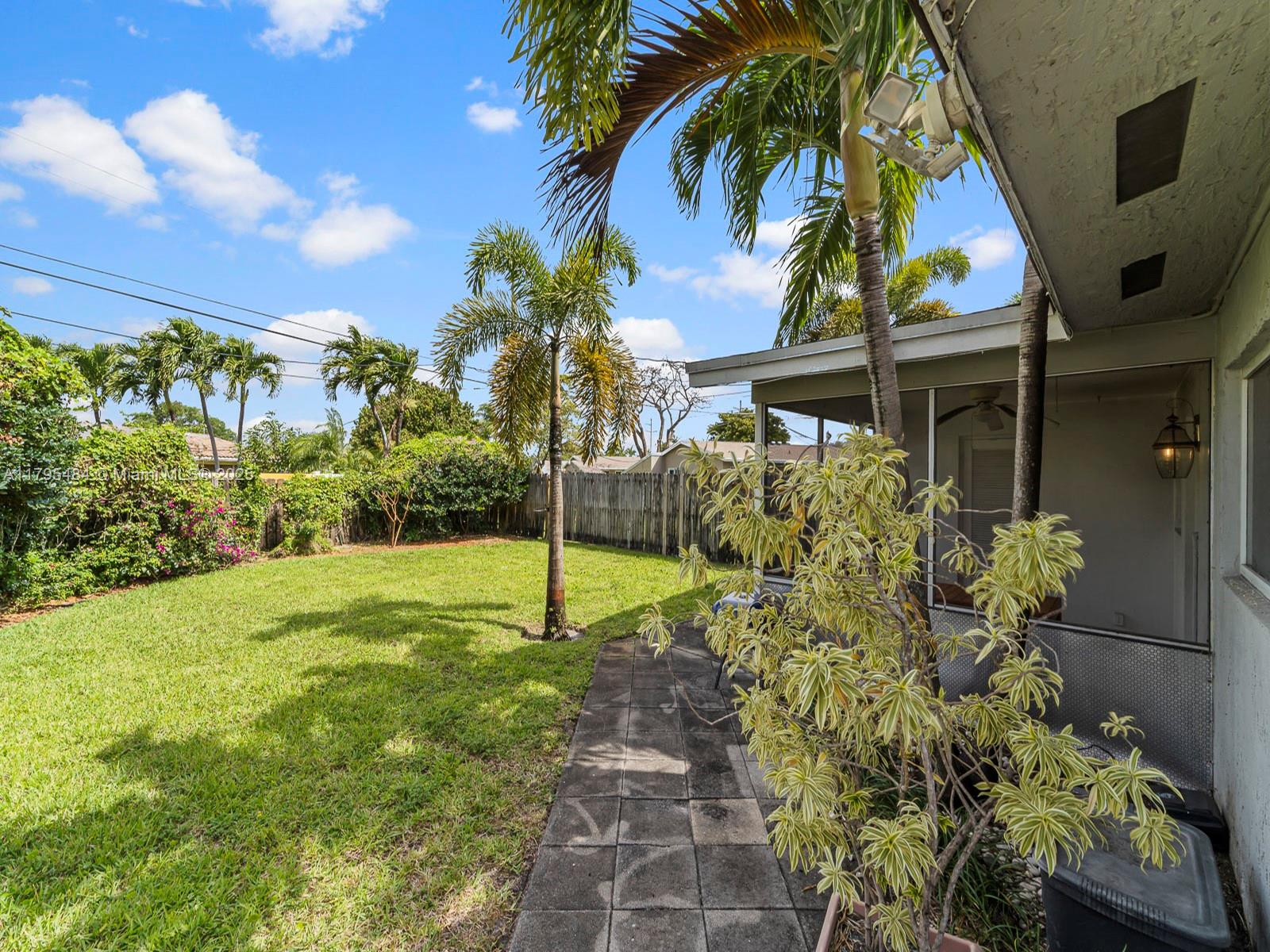 1761 Northeast 52nd Street, Unit 12 Fort Lauderdale, FL 33334 - Photo 3 of 19 a view of a garden