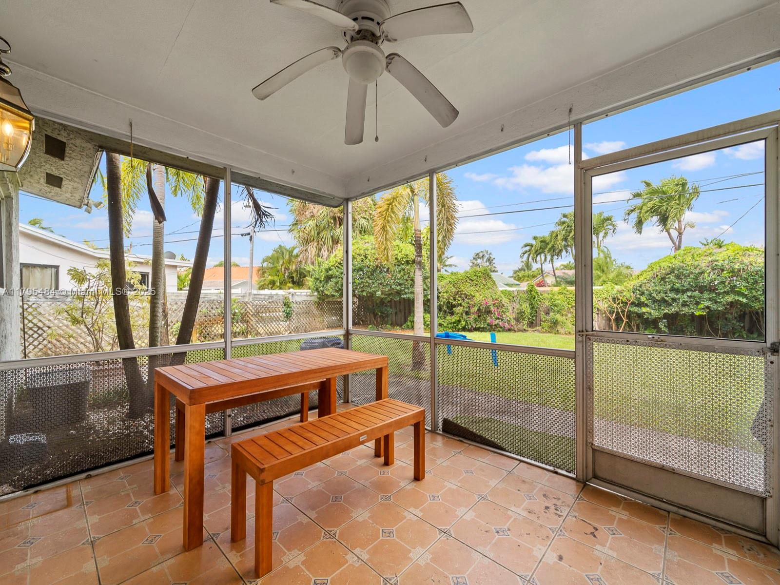1761 Northeast 52nd Street, Unit 12 Fort Lauderdale, FL 33334 - Photo 7 of 19 a room with pool table and glass door