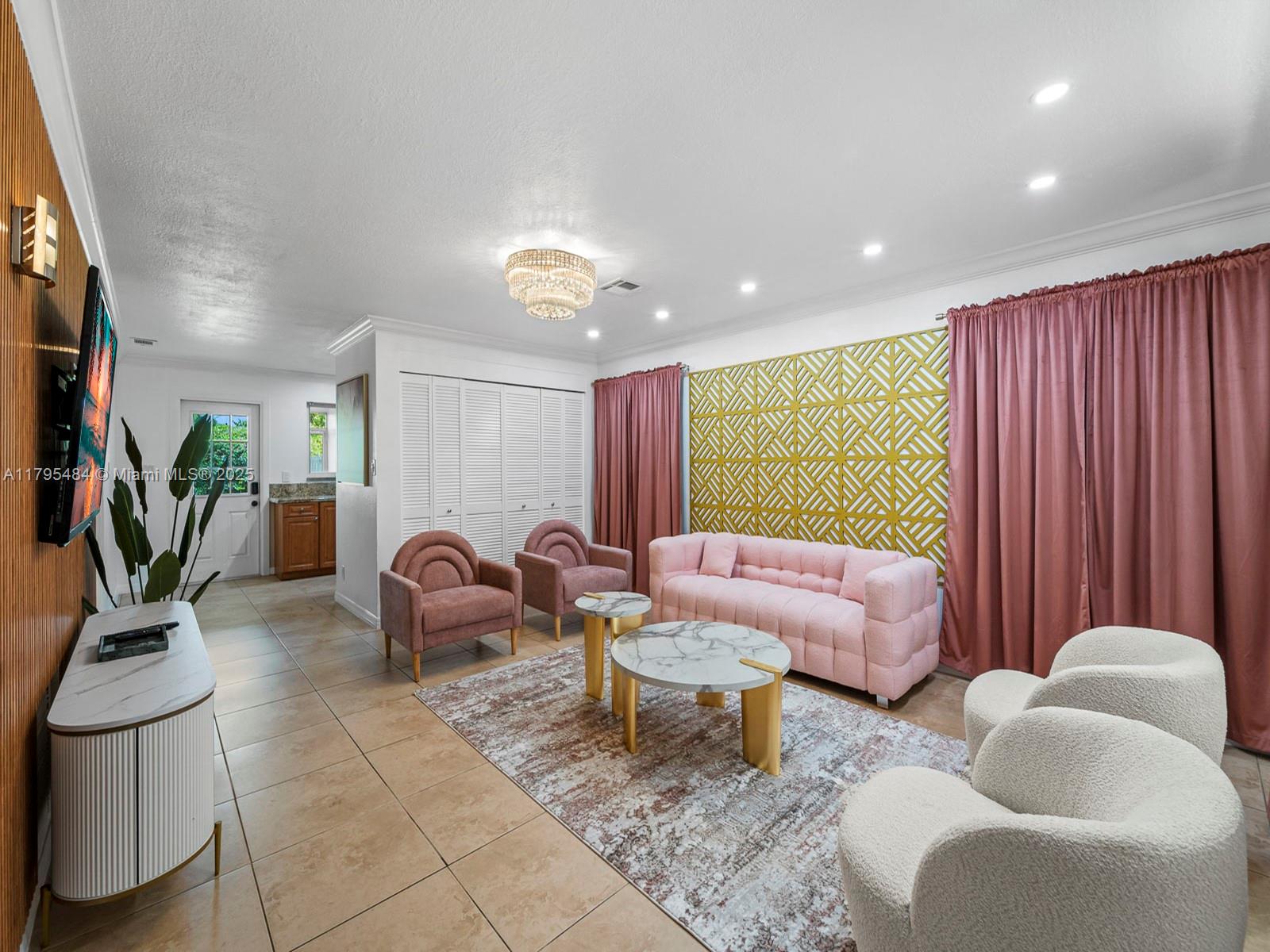 1761 Northeast 52nd Street, Unit 12 Fort Lauderdale, FL 33334 - Photo 9 of 19 a living room filled with furniture