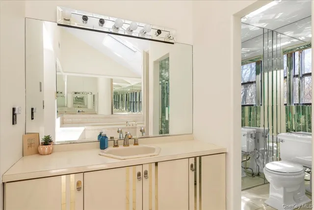 a bedroom with a bed a desk and chair