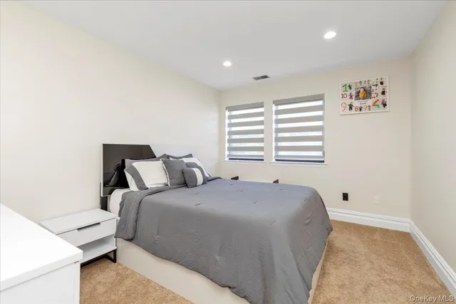 a bed room with a bed and a chair