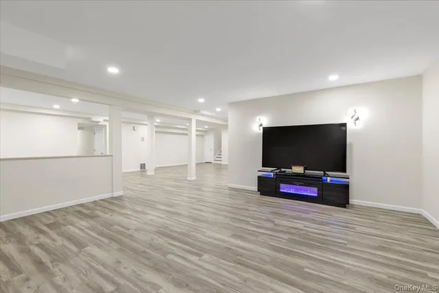 a view of a hall with wooden floor