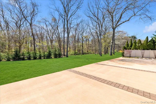 a picture of a room with a white wall and picture