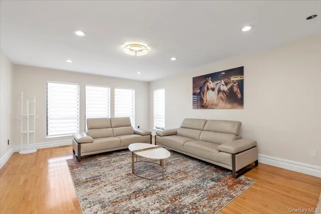 a living room with furniture and a rug