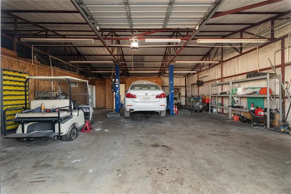 a view of parking garage with cars