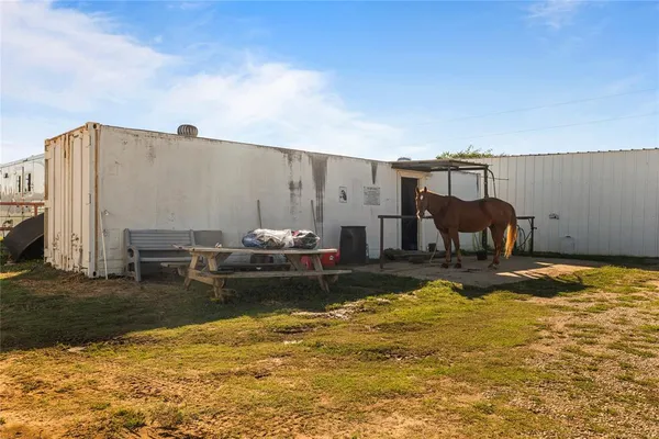 a view of a swimming pool with a yard