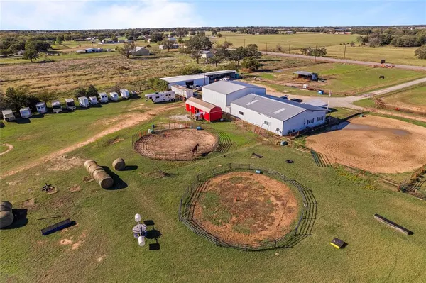 an aerial view of a house with outdoor space