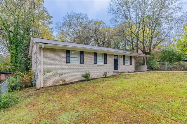 a house with trees in the background
